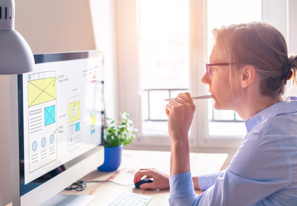 woman working on laptop on a marketing document
